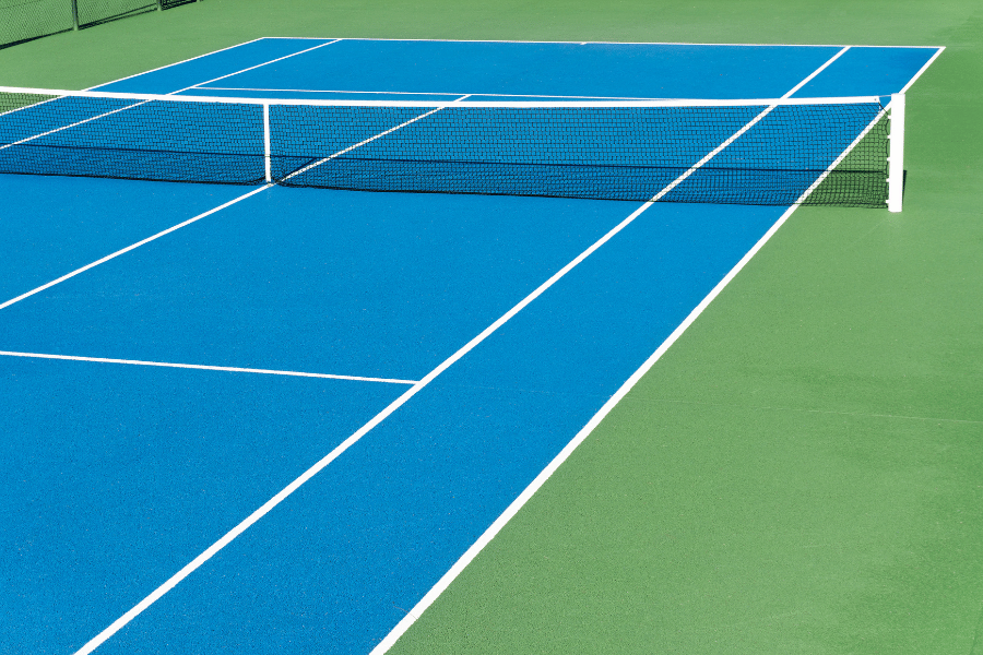 Blue tennis court with a net 