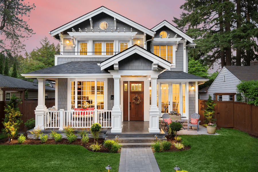 beautiful suburban home with front porch and nice landscaping