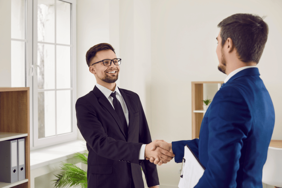 buyers agent negotiating and shaking hands 