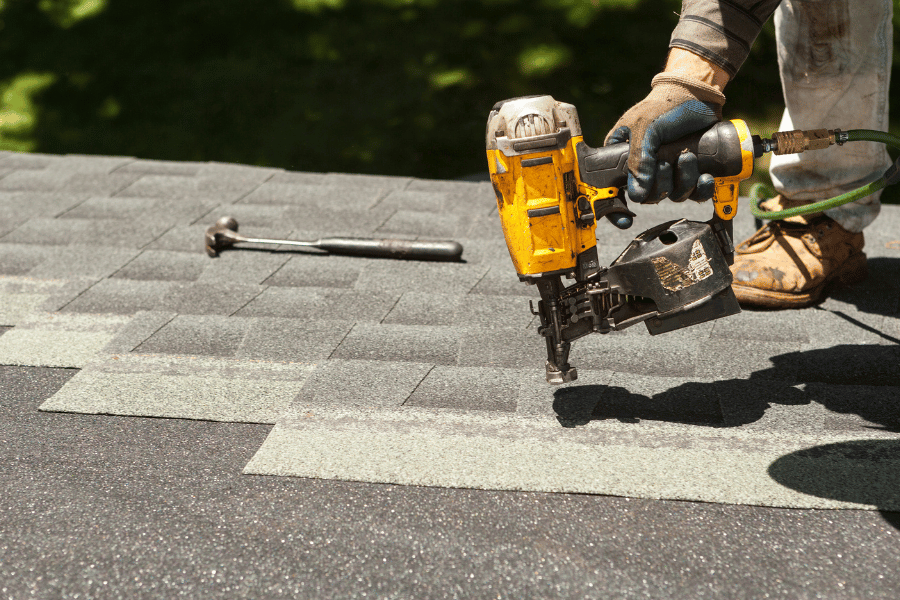 Roof Shingle Replacement with nail gun and hammer
