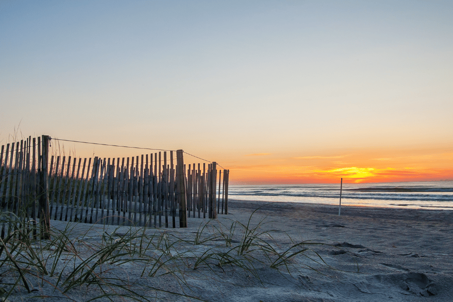 Wrightsville Beach sand with orange sunset behind