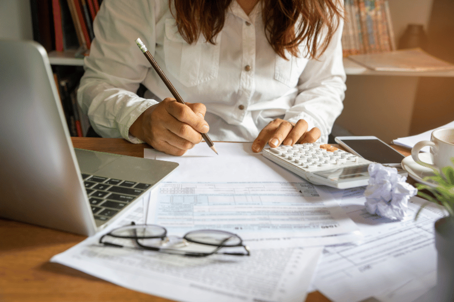 Woman budgeting for a house and calculating expenses 