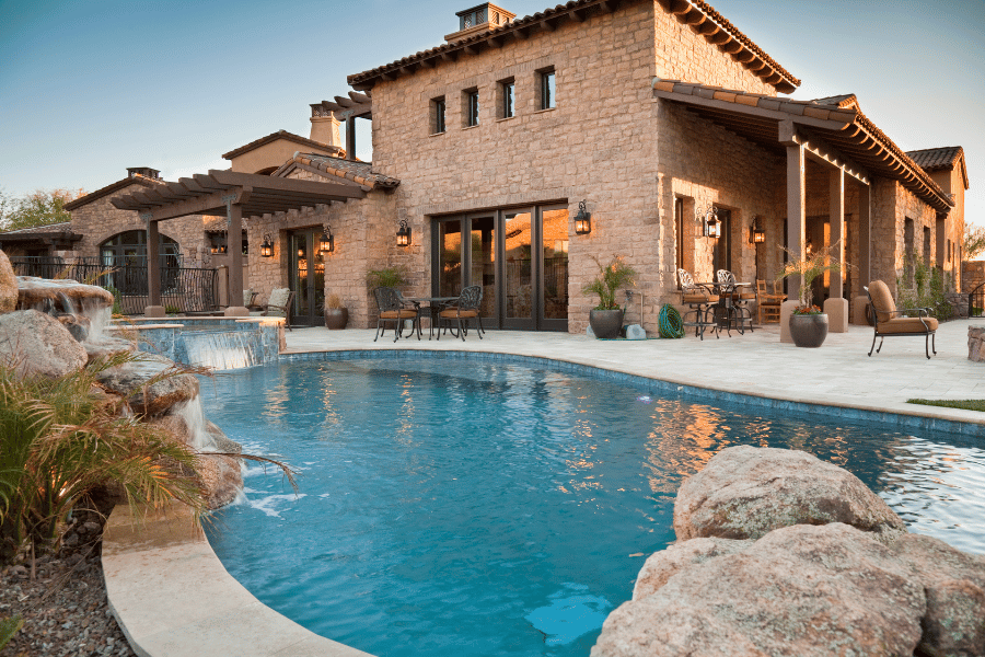 beautiful luxury home with large pool and outdoor seating