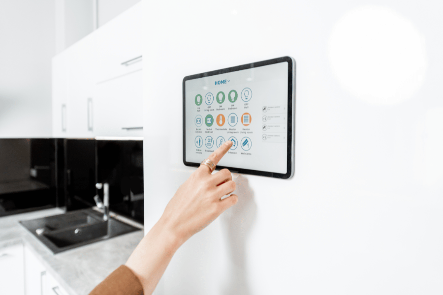smart home technology tablet on the wall used to make a home handicap accessible