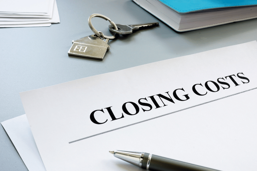 closing costs on a paper with pen and home key