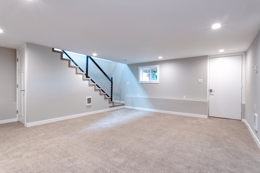 Beautiful finished basement with carpet and a staircase