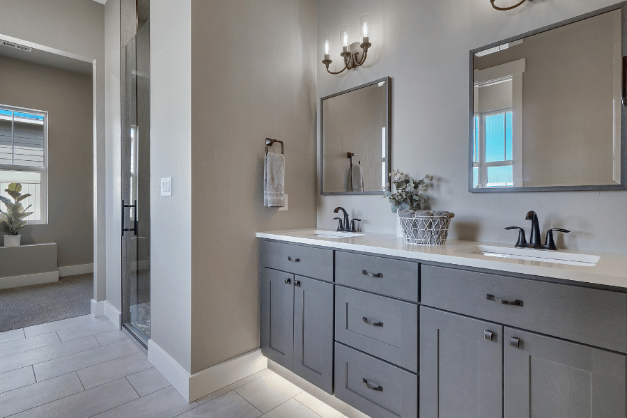 modern bathroom with two sinks and tile flooring