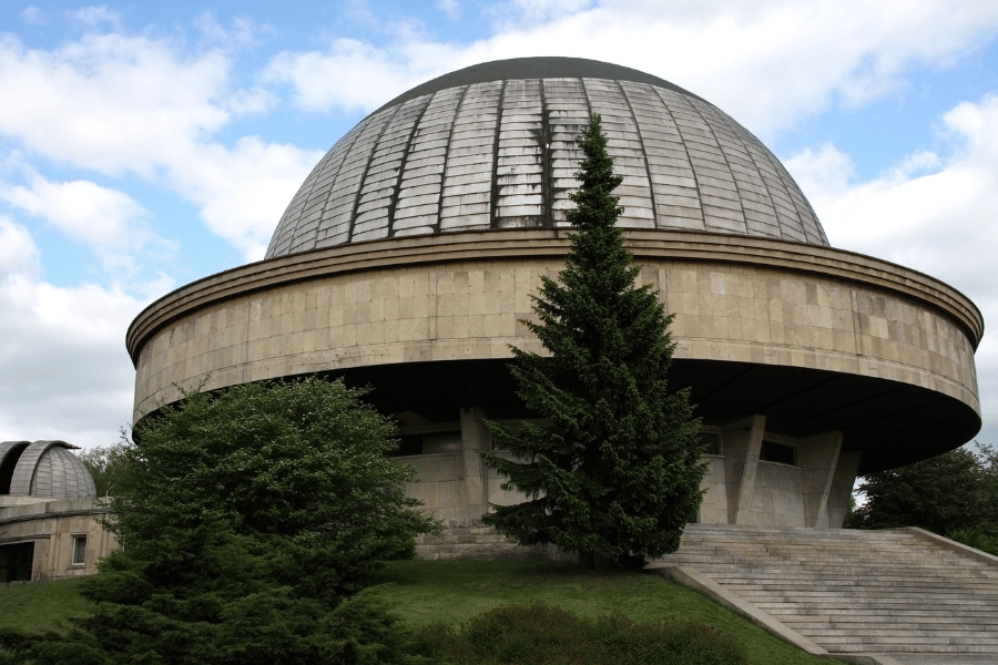 Planetarium Dome in NC with green trees around
